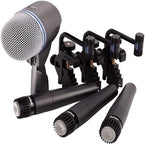 Four drum microphones arranged with a dynamic microphone for optimal sound capture in a studio setting.