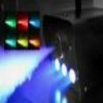 Fog & Haze Machines emitting colorful light beams in a dark environment for atmospheric effects.