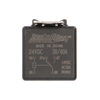 Black relay box with metal terminals for automotive electrical connections.