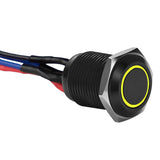 Close-up of Install Bay MB12Y-2 black 12MM round illuminated momentary switches with yellow ring and wires.