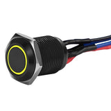  Close-up of Install Bay MB12Y-2 black 12MM round illuminated momentary switches with yellow ring and wires.
