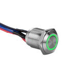 Close-up of Install Bay MS12G-2 illuminated momentary switches with green light and wires.