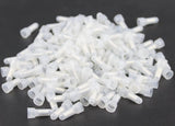 1000 white crimp cap connectors in a pile, ideal for electrical wiring and connections. Nylon, closed ends for secure fit.