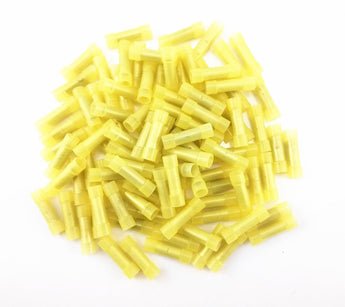 A pile of yellow nylon crimp terminals connectors for reliable electrical connections.